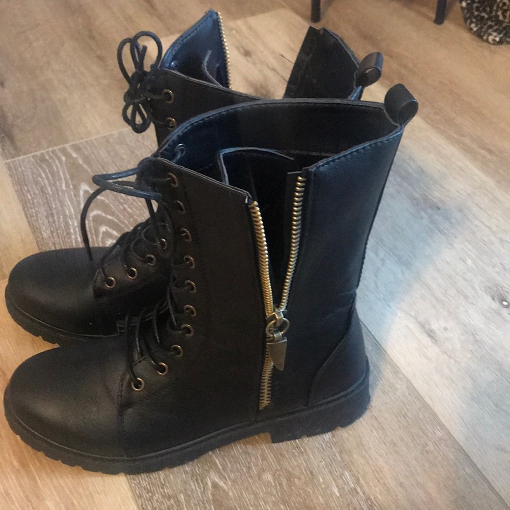 Lace up Moto boot with gold detailed zipper.